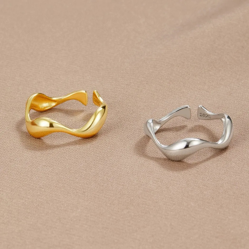 Adjustable minimalist ring in 18K gold plated sterling silver featuring an ocean-inspired design, perfect for elegant and modern jewelry collections. 4