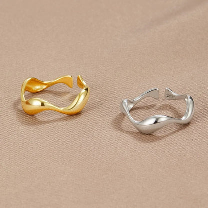 Adjustable minimalist ring in 18K gold plated sterling silver featuring an ocean-inspired design, perfect for elegant and modern jewelry collections. 4