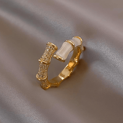 Adjustable gold-plated opal ring featuring a stunning gemstone, perfect for adding elegance to any outfit. 0