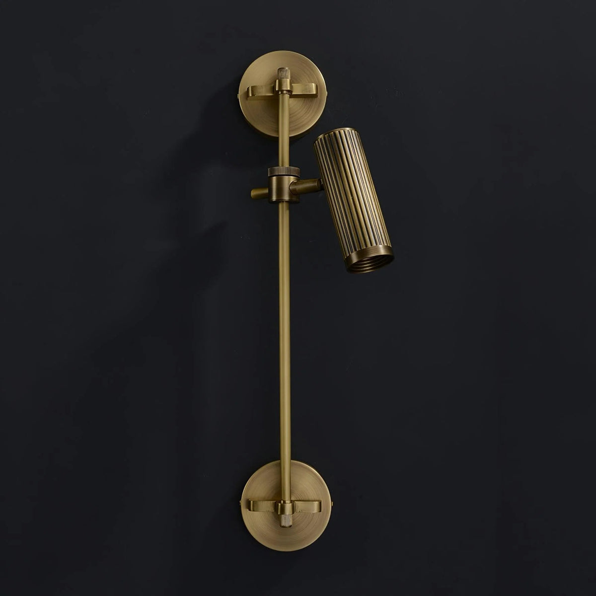 Adjustable wall light with a stylish bronze finish, featuring a durable brass and metal structure, perfect for modern sconces in contemporary home decor. 0