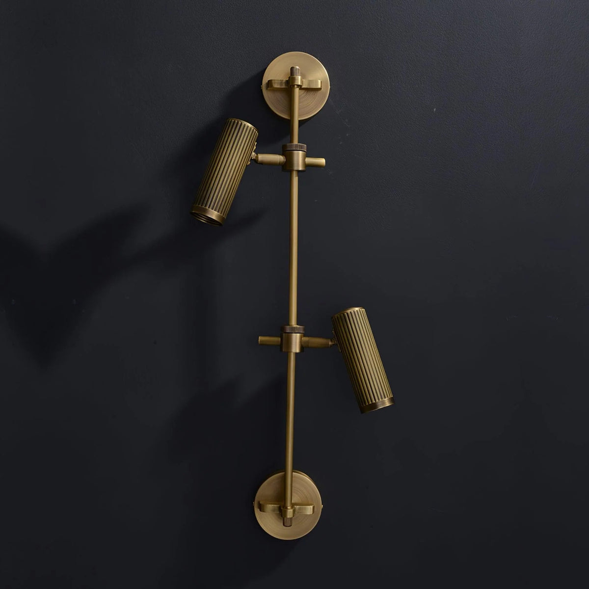 Adjustable wall light with a stylish bronze finish, featuring a durable brass and metal structure, perfect for modern sconces in contemporary home decor. 3