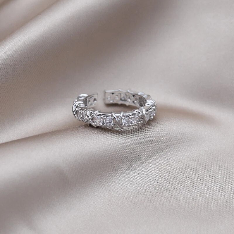 Adjustable wellness ring featuring magnetic zirconia and titanium ion therapy in an elegant gold and silver design, promoting health and style. 6