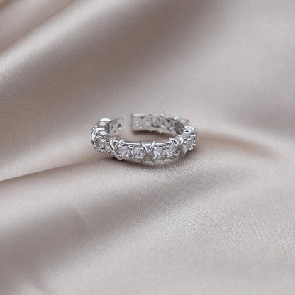 Adjustable wellness ring featuring magnetic zirconia and titanium ion therapy in an elegant gold and silver design, promoting health and style. 6