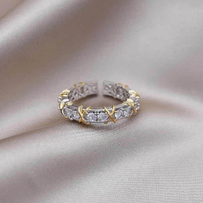 Adjustable wellness ring featuring magnetic zirconia and titanium ion therapy in an elegant gold and silver design, promoting health and style. 2