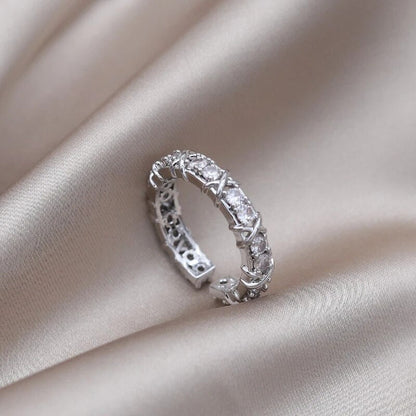 Adjustable wellness ring featuring magnetic zirconia and titanium ion therapy in an elegant gold and silver design, promoting health and style. 0