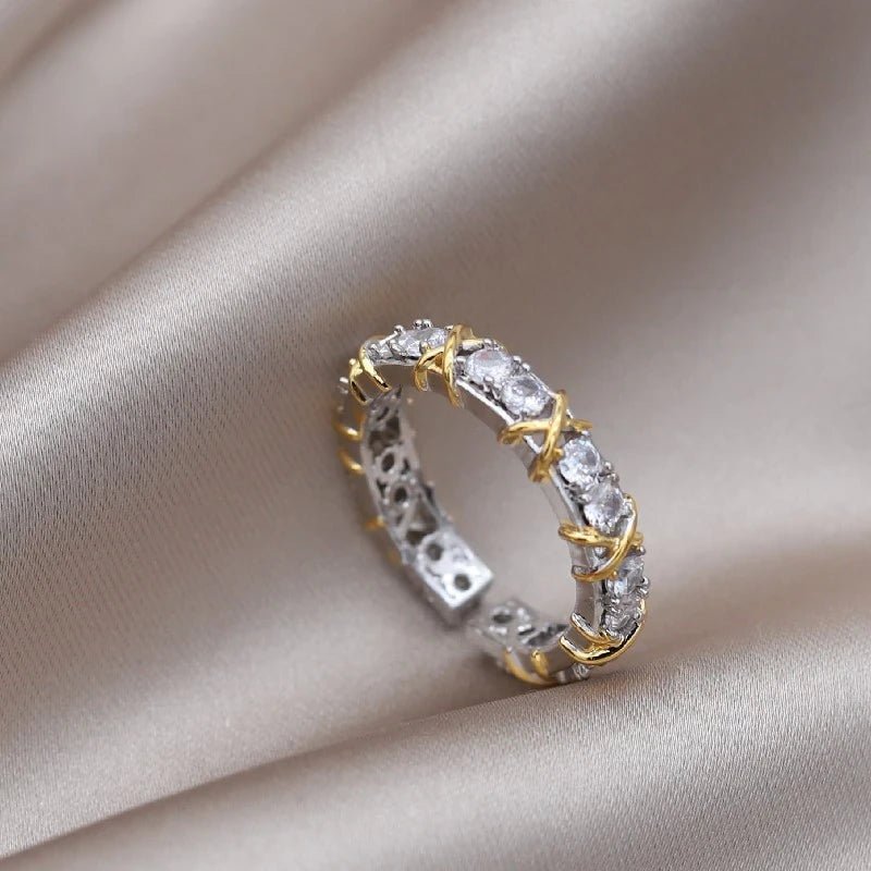 Adjustable wellness ring featuring magnetic zirconia and titanium ion therapy in an elegant gold and silver design, promoting health and style. 1