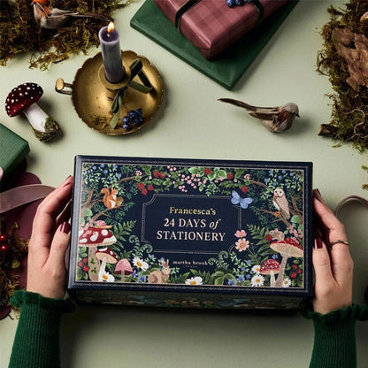 Advent Calendar featuring 24 days of stationery and office supplies, designed with a charming winter forest theme. 1