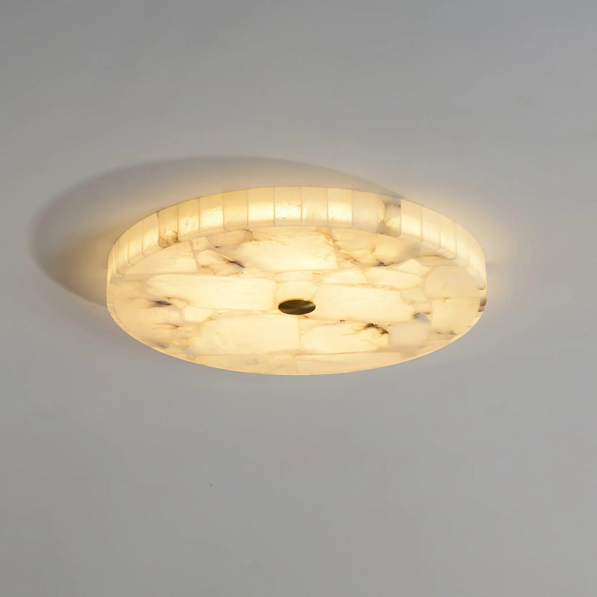 Alabaster flush mount ceiling light featuring a modern design with integrated LED for soft ambient lighting in contemporary interiors. 0
