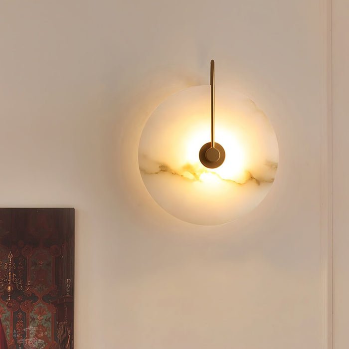 Alabaster wall lamp featuring integrated LED lighting and a unique snowflake pattern, designed with a modern minimalist aesthetic in black metal. 0