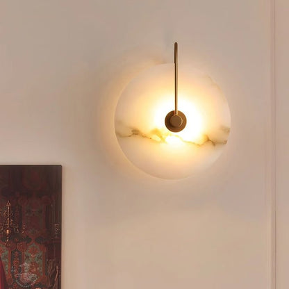 Alabaster wall lamp featuring integrated LED lighting and a unique snowflake pattern, designed with a modern minimalist aesthetic in black metal. 4