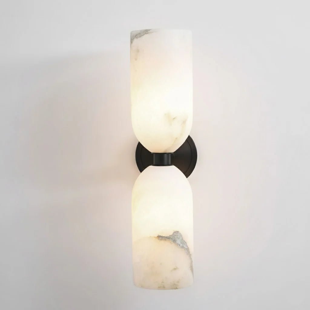 Alabaster wall light featuring an elegant up and down glow design, available in copper, black, or bronze finishes, perfect for modern home decor. 10