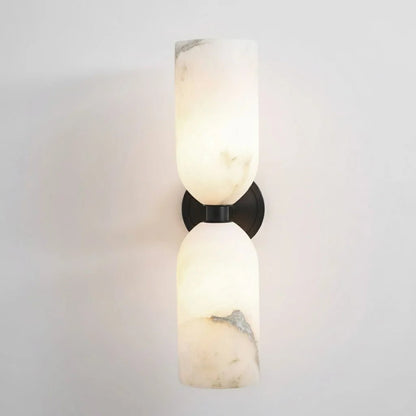 Alabaster wall light featuring an elegant up and down glow design, available in copper, black, or bronze finishes, perfect for modern home decor. 10