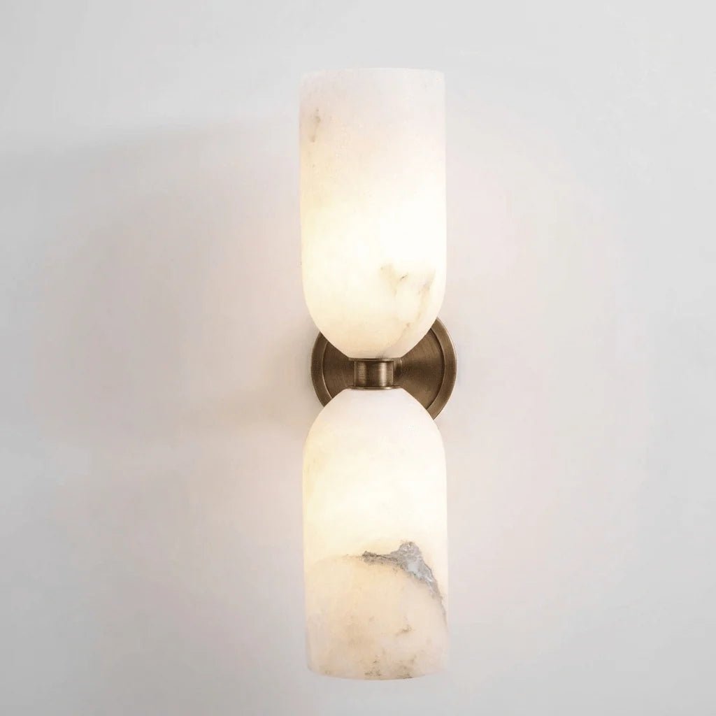 Alabaster wall light featuring an elegant up and down glow design, available in copper, black, or bronze finishes, perfect for modern home decor. 9