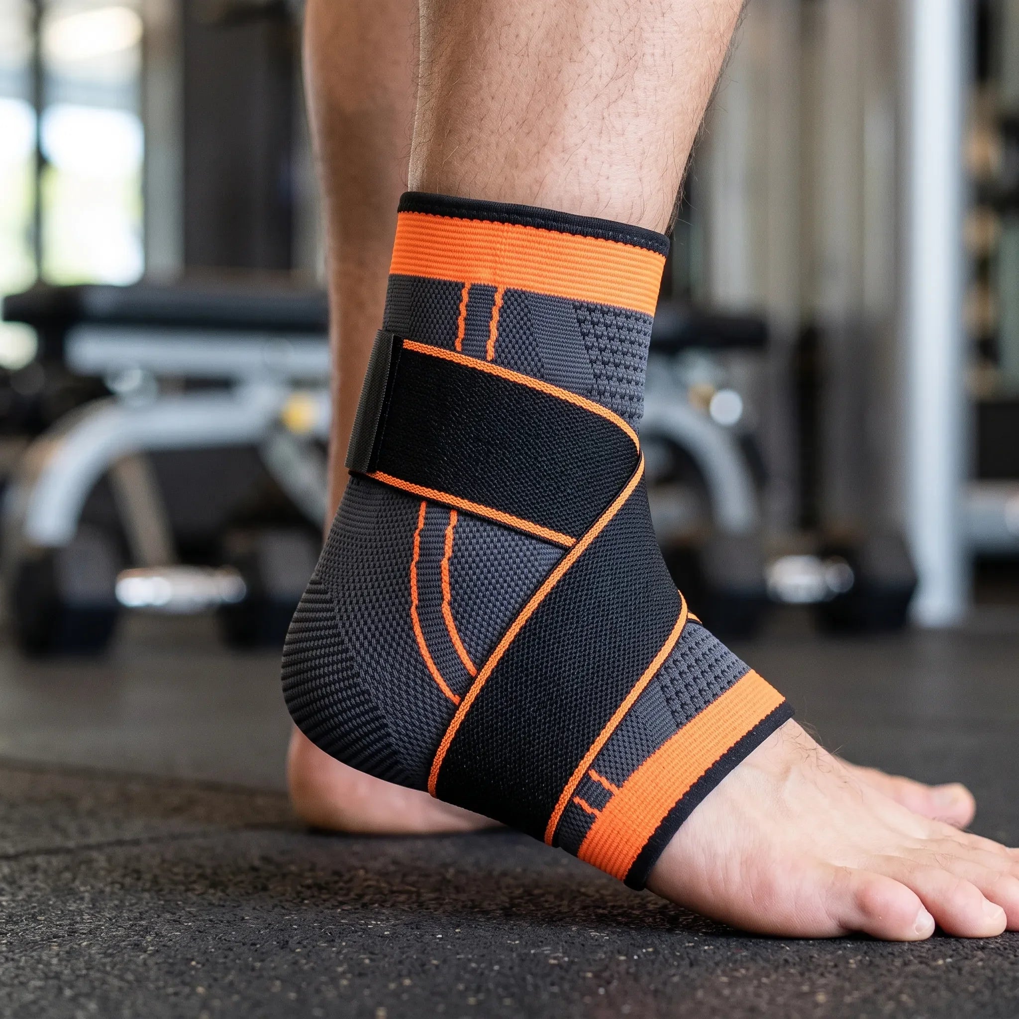 Adjustable ankle brace with cross-strap support, breathable knitted compression sleeve designed for basketball and sports activities. 0