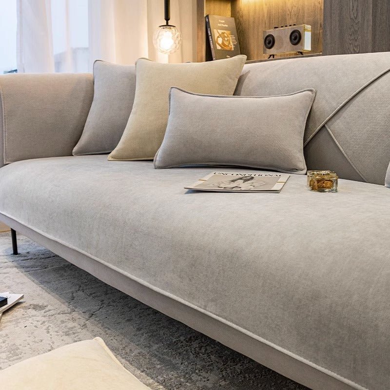 Anti-slip sofa cover designed for pet protection and stain resistance, featuring durable washable fabric and a modern design, available in multiple colors. 1