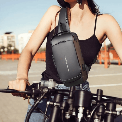Anti-theft chest bag in black featuring RFID protection and ergonomic design, perfect for secure travel organization. 1