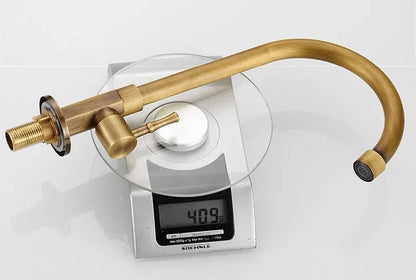 Antique brass kitchen faucet with swan neck spout and ceramic valve, showcasing an elegant design perfect for modern kitchens. 5