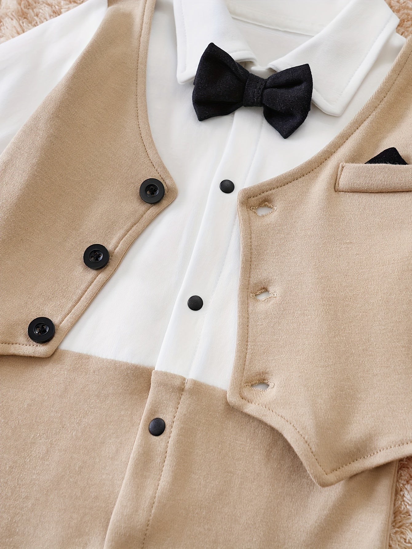 Baby romper featuring a stylish bow tie and cardigan design, made from soft cotton, perfect for special occasions and ensuring comfort for infants. 3