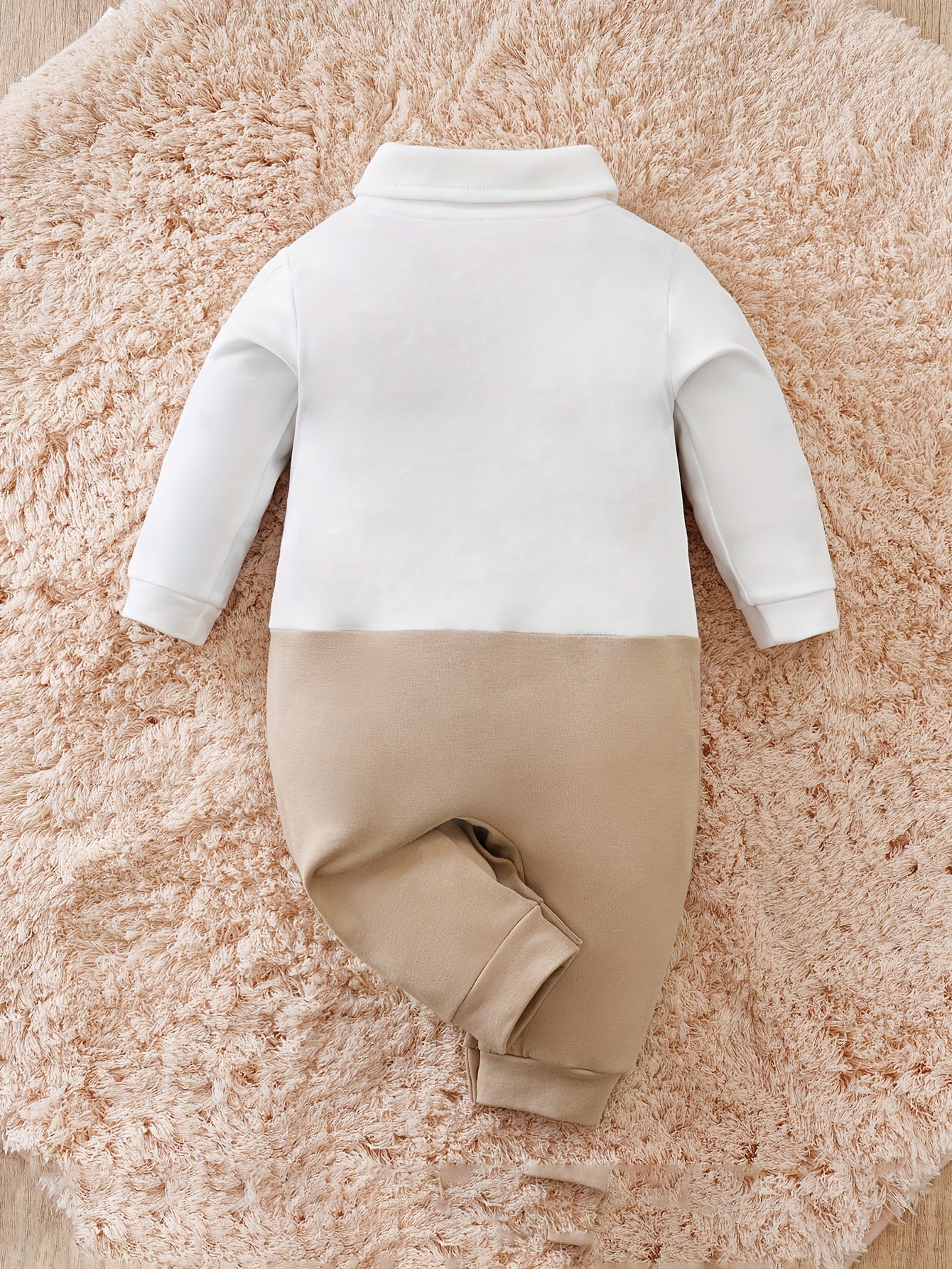 Baby romper featuring a stylish bow tie and cardigan design, made from soft cotton, perfect for special occasions and ensuring comfort for infants. 1