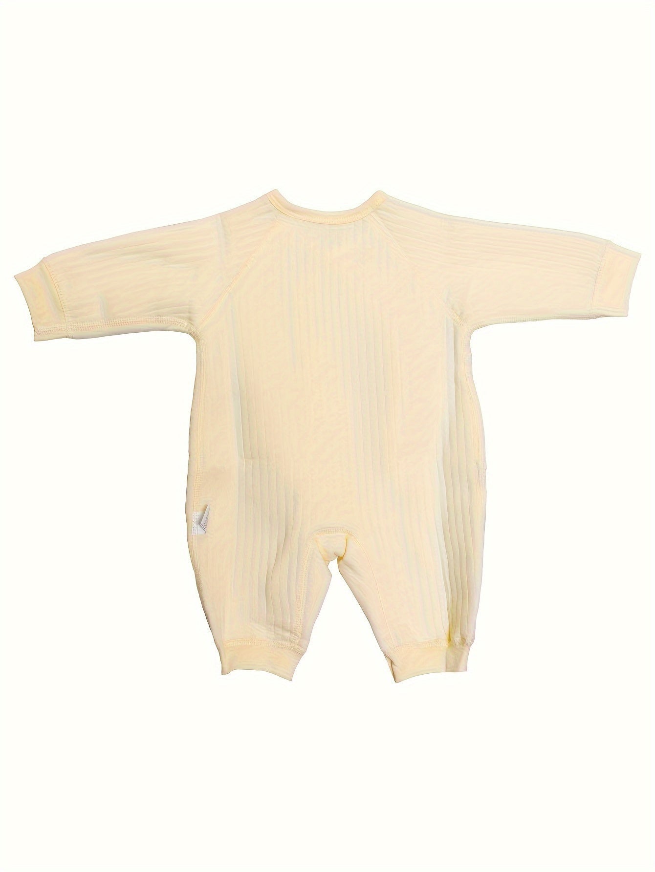 Baby romper featuring a playful bear patch, made from soft cotton for breathability during fall and winter, designed for easy dressing with bows and buttons. 4