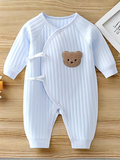 Baby romper featuring a playful bear patch, made from soft cotton for breathability during fall and winter, designed for easy dressing with bows and buttons. 3