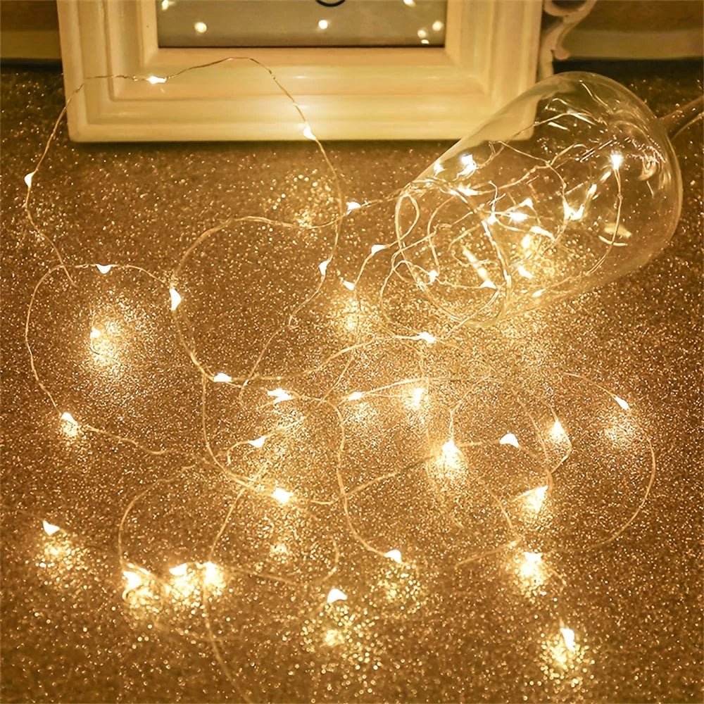 Battery-powered copper fairy lights featuring energy-efficient LED options, available in multiple lengths and colors, perfect for creating a magical ambiance in any space. 7