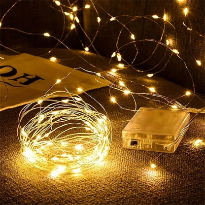Battery-powered copper fairy lights featuring energy-efficient LED options, available in multiple lengths and colors, perfect for creating a magical ambiance in any space. 1