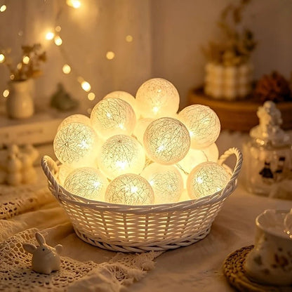 Battery-powered globe string lights featuring 10 LED white plastic spheres, perfect for indoor decoration and party ambiance. 2