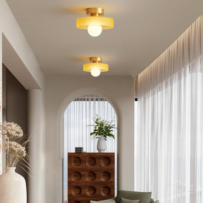 Bauhaus ceiling lamp featuring a minimalist design with a spherical glass shade and brass accents, perfect for modern bedroom decor. 4