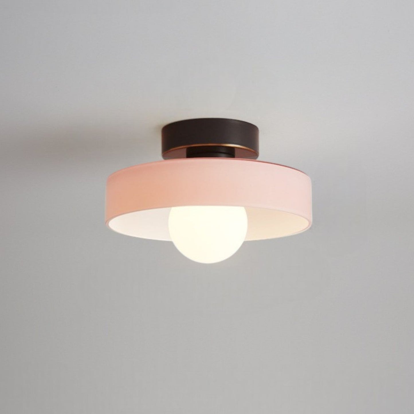 Bauhaus ceiling lamp featuring a minimalist design with a spherical glass shade and brass accents, perfect for modern bedroom decor. 5