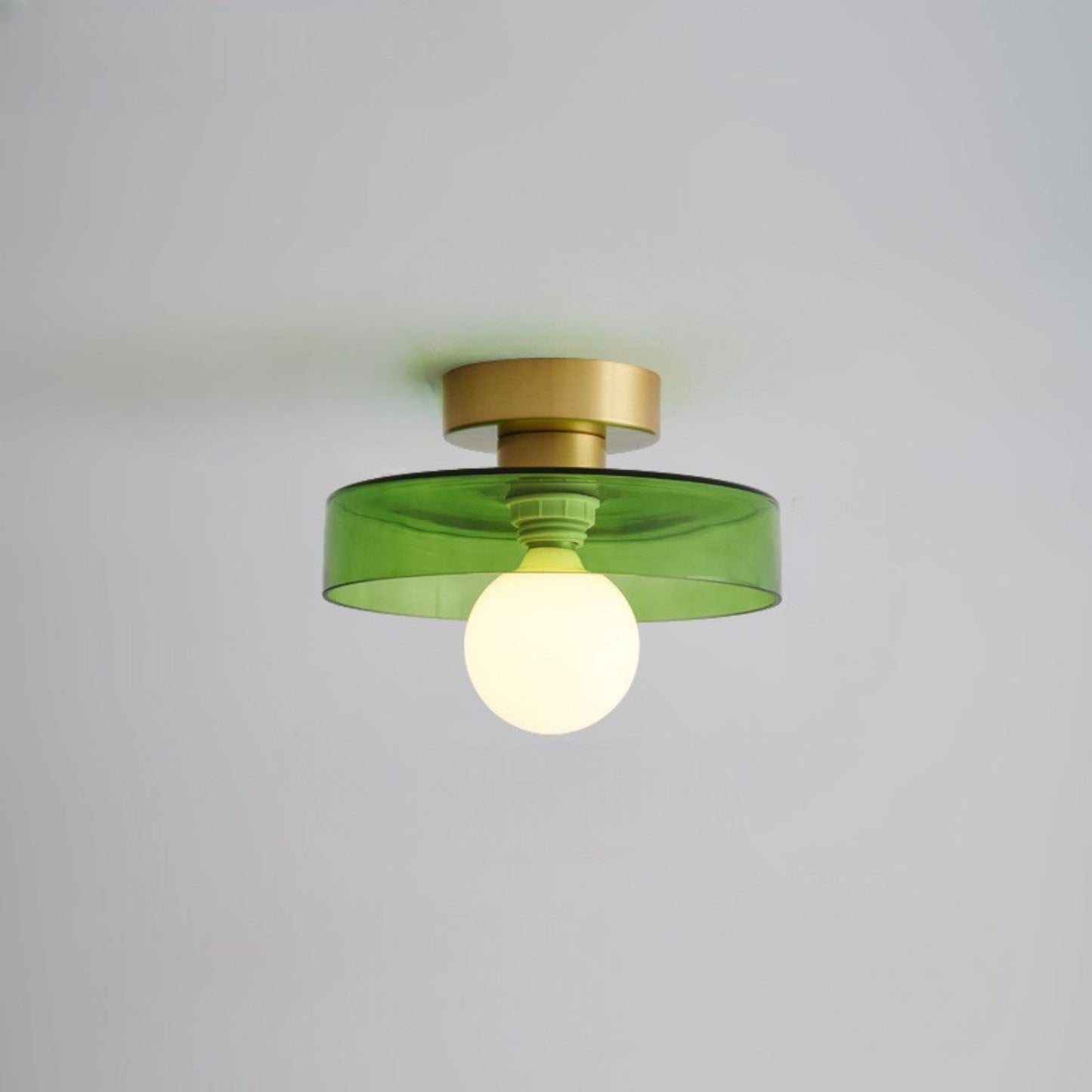 Bauhaus ceiling lamp featuring a minimalist design with a spherical glass shade and brass accents, perfect for modern bedroom decor. 12
