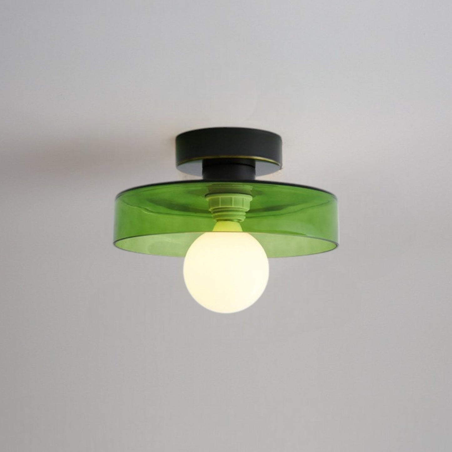 Bauhaus ceiling lamp featuring a minimalist design with a spherical glass shade and brass accents, perfect for modern bedroom decor. 10
