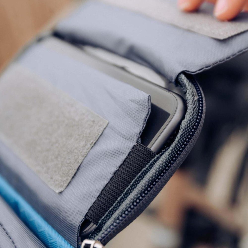 Bike handlebar bag featuring a secure phone holder, designed for waterproof storage of essentials while cycling. 3