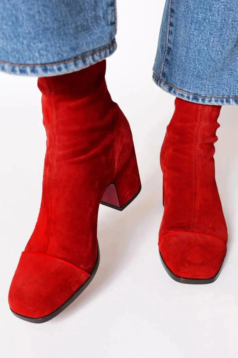 Black ankle boots for women featuring a stylish square toe and sturdy block heel, adorned with a chic animal print contrast panel for a trendy, fashionable look. 2