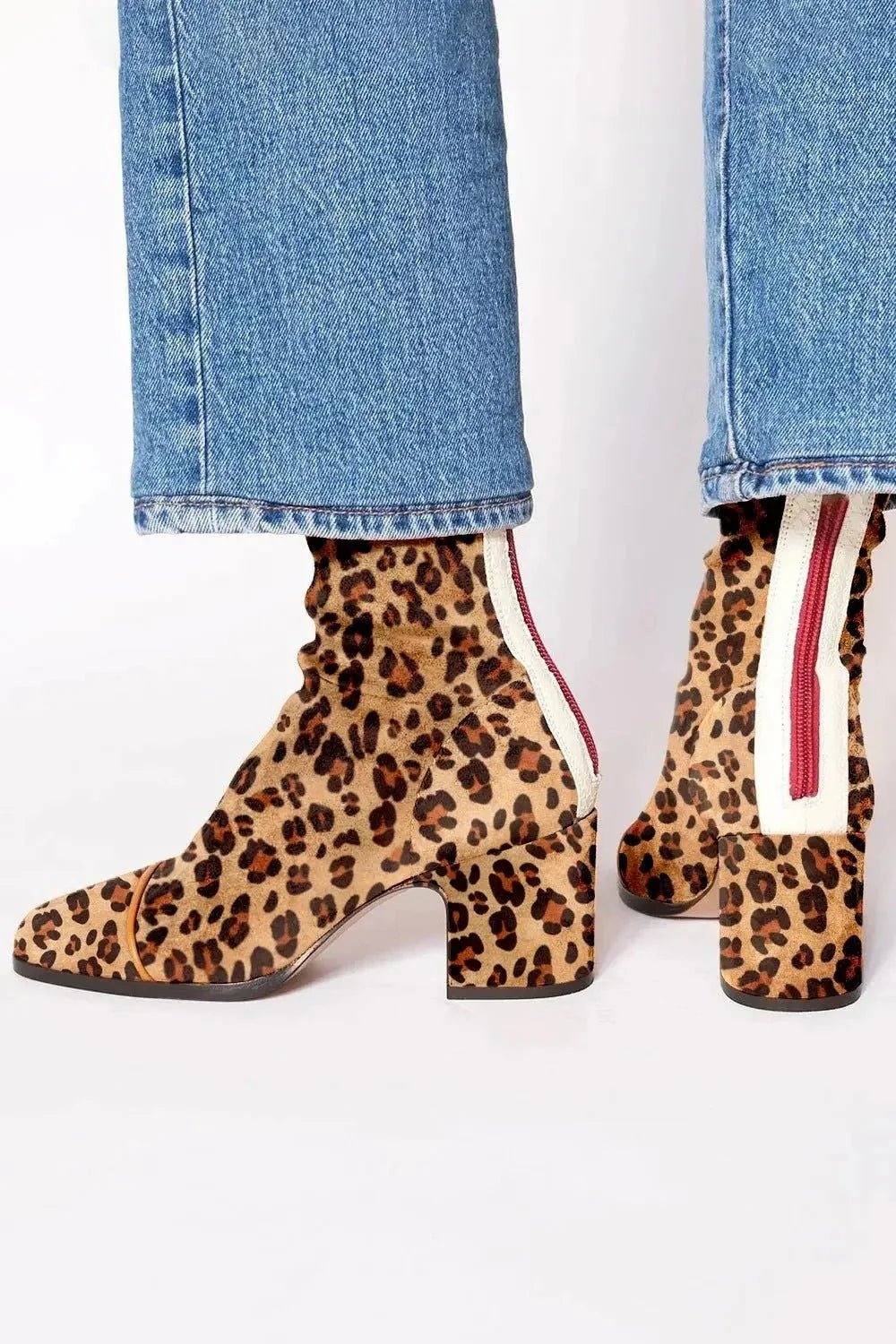 Black ankle boots for women featuring a stylish square toe and sturdy block heel, adorned with a chic animal print contrast panel for a trendy, fashionable look. 4