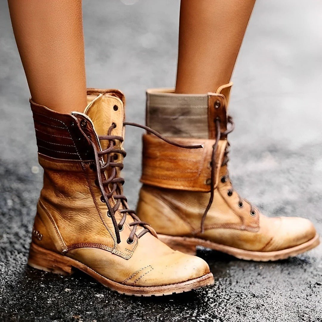 Black ankle boots for women featuring arch support and a non-slip sole, designed in a vintage distressed lace-up combat style. 2