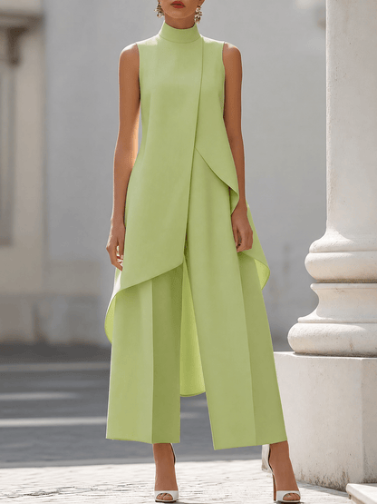 Elegant black jumpsuit for women featuring a high neckline and draped overlay, designed with a chic wide-leg silhouette, perfect for special occasions. 9