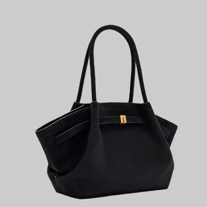 Elegant black shoulder bag with large capacity and adjustable straps, featuring a chic faux suede design for stylish women. 2