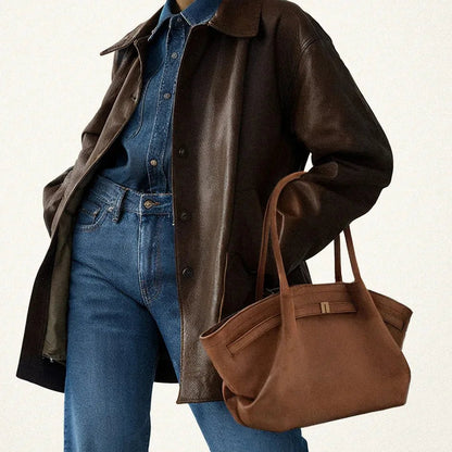 Elegant black shoulder bag with large capacity and adjustable straps, featuring a chic faux suede design for stylish women. 4