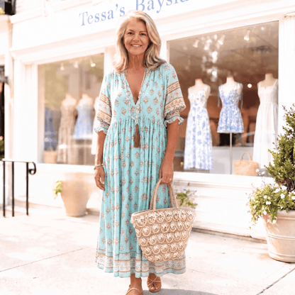 Boho maxi dress featuring a lightweight floral design and a matching belt, perfect for summer events. 7
