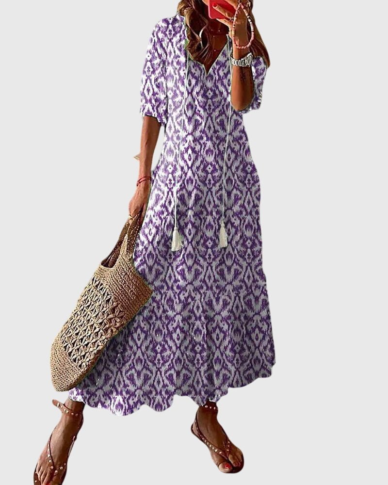 Boho vintage summer dress featuring a flattering V-neckline, lightweight fabric, and versatile design perfect for casual outings or beach days. 2