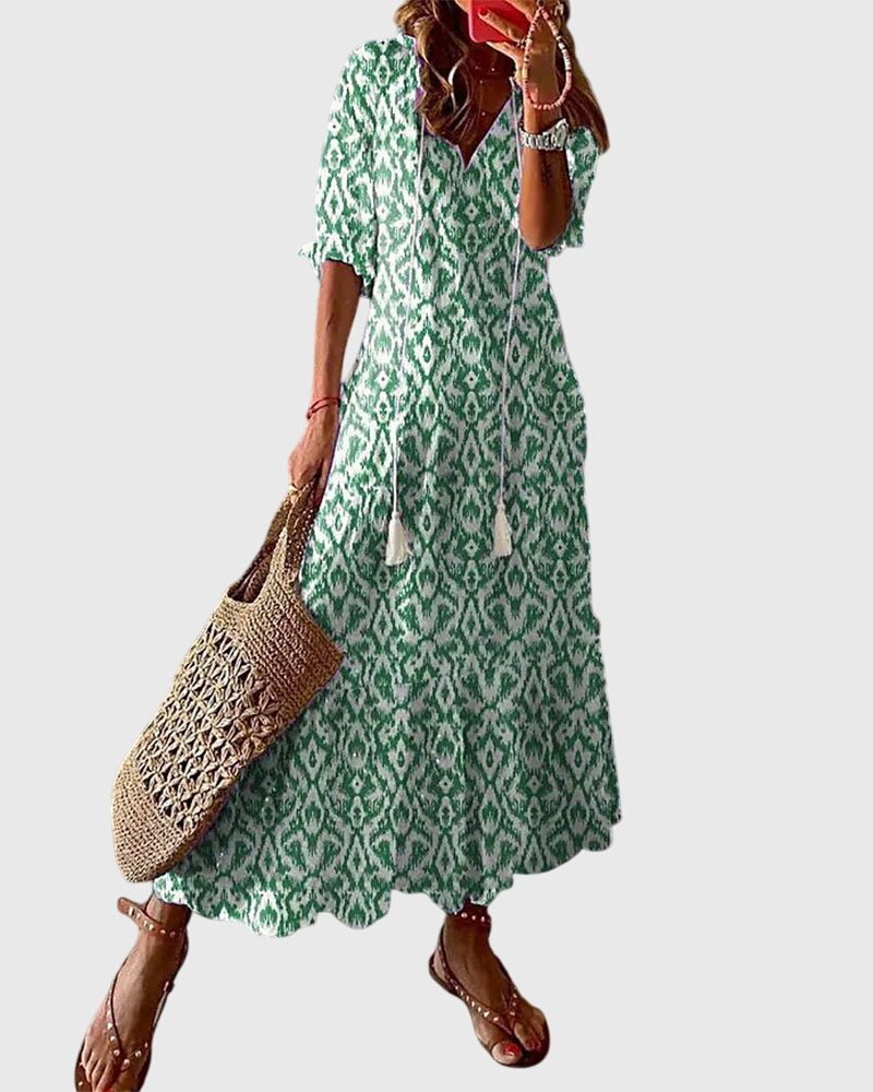 Boho vintage summer dress featuring a flattering V-neckline, lightweight fabric, and versatile design perfect for casual outings or beach days. 1