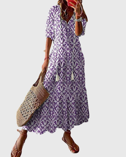 Boho vintage summer dress featuring a flattering V-neckline, designed with a lightweight and breezy fabric for effortless casual elegance. 2