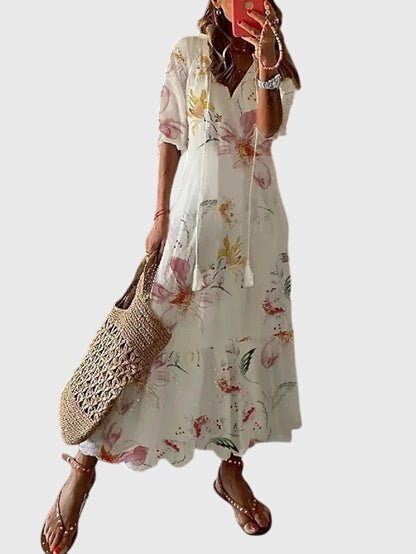 Boho vintage summer dress featuring a flattering V-neckline, designed with a lightweight and breezy fabric for effortless casual elegance. 7