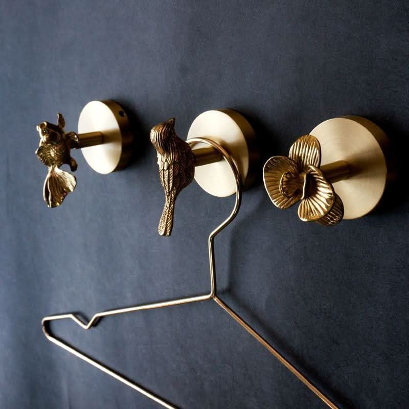 Brass animal wall hook rack with a gold finish, featuring decorative coat hooks perfect for enhancing home decor. 1
