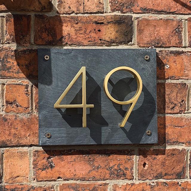 Elegant brass house numbers with a satin finish, designed for floating or flat installation, featuring a weather-resistant design for durability and style. 1