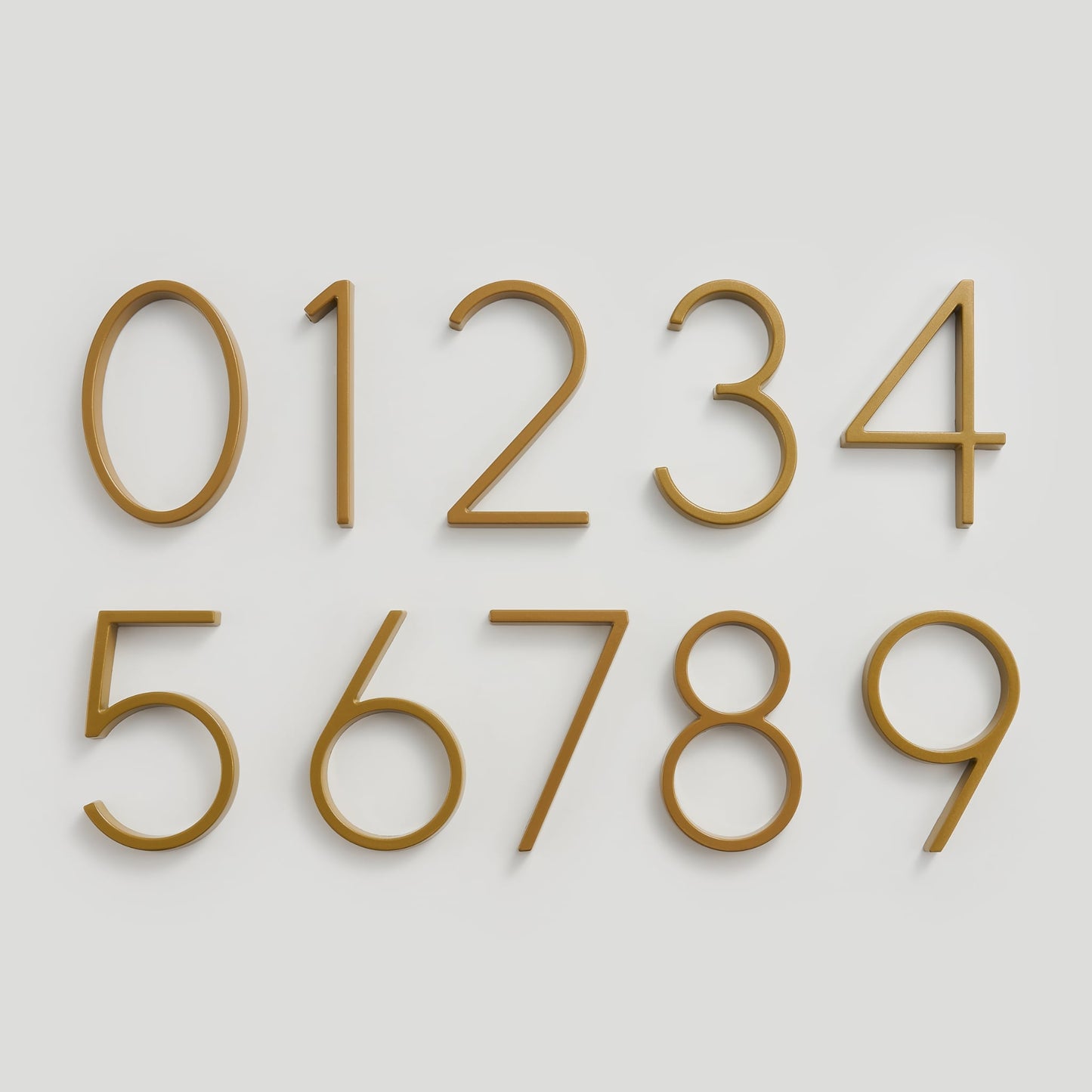 Elegant brass house numbers with a satin finish, designed for floating or flat installation, featuring a weather-resistant design for durability and style. 4