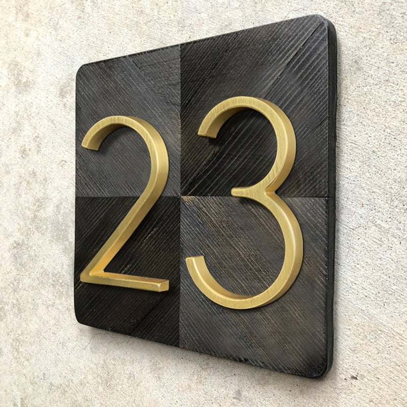 Elegant brass house numbers with a satin finish, designed for floating or flat installation, featuring a weather-resistant design for durability and style. 7