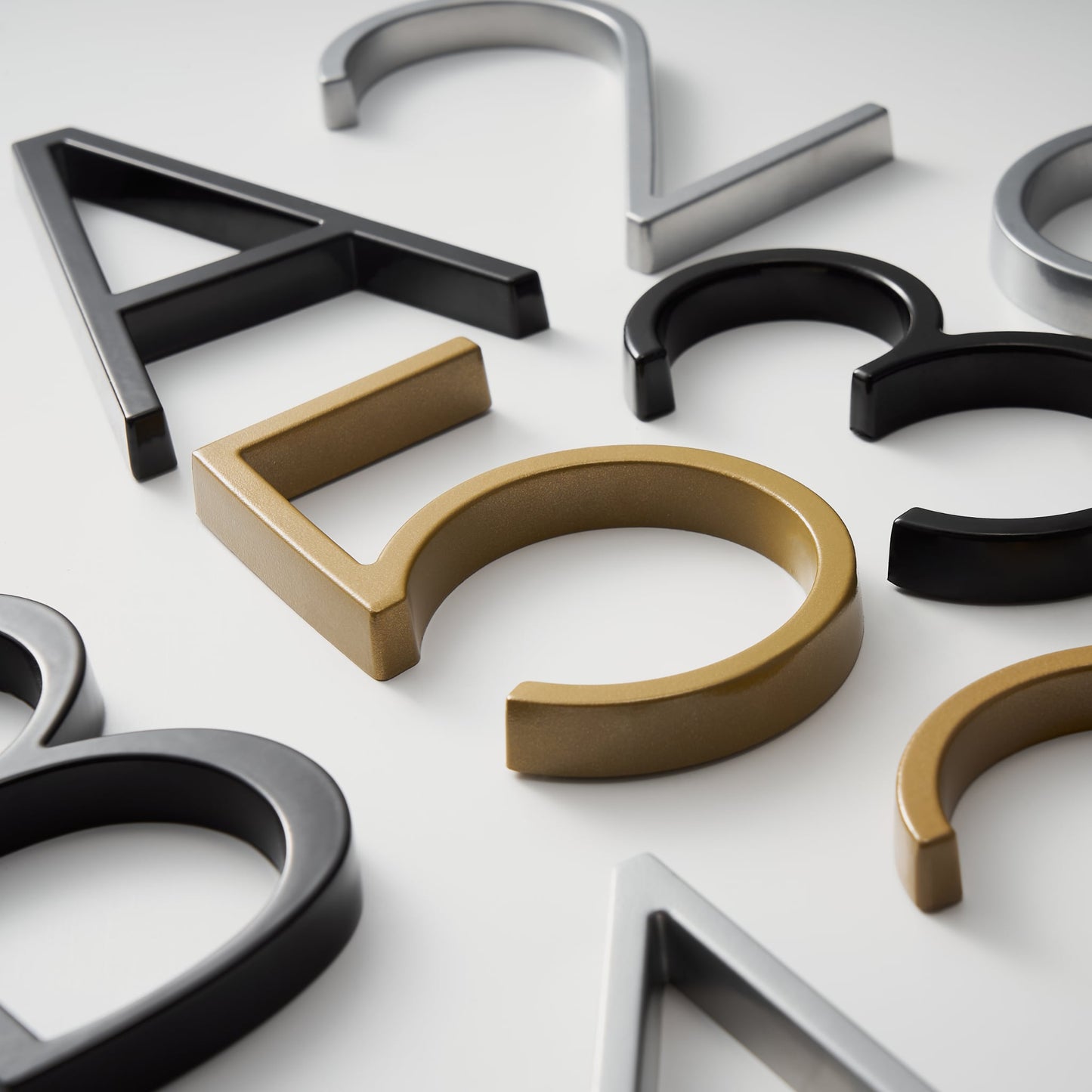 Elegant brass house numbers with a satin finish, designed for floating or flat installation, featuring a weather-resistant design for durability and style. 6