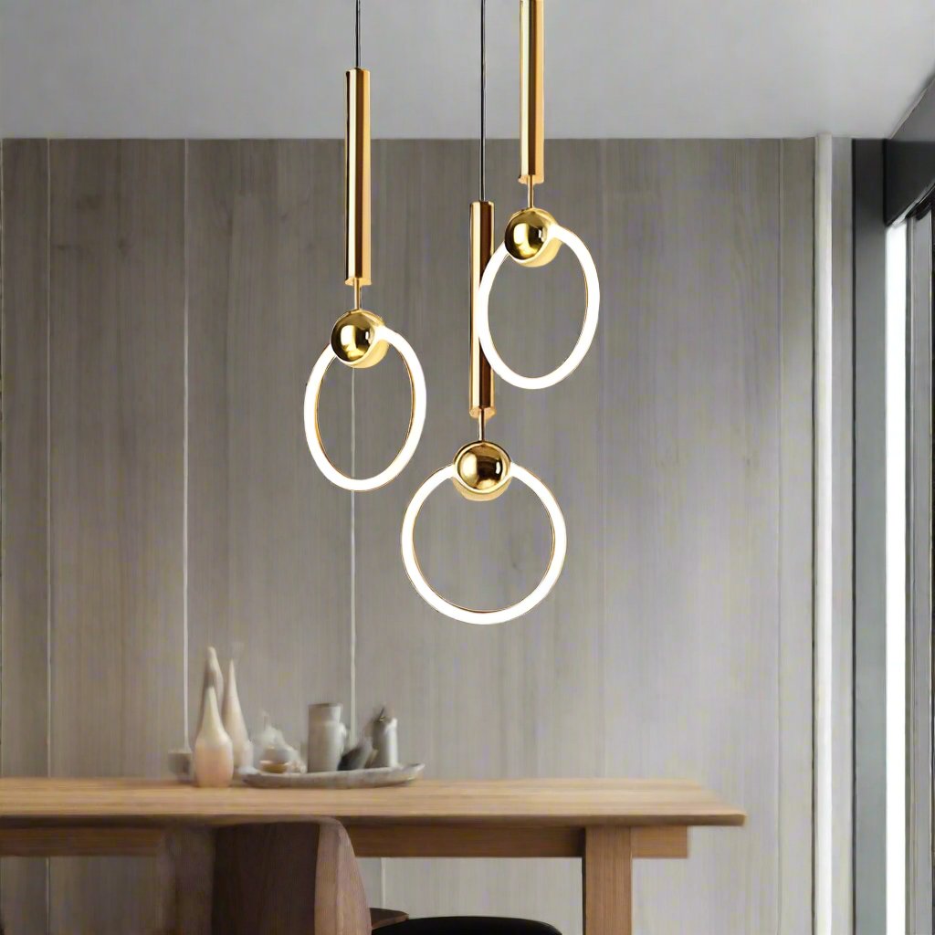Brass pendant light featuring a minimalist design, ideal for illuminating a kitchen island with a Nordic aesthetic. 1